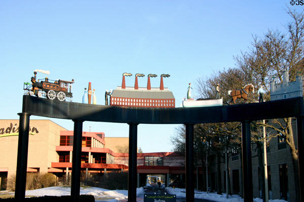 Corning Centennial Sculpture (1996) with steam locomotive, cigar, glass factory, & canal barge at end of Market St. Corning, NY.