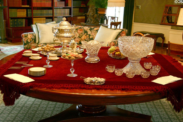 Table set for afternoon refreshment punch bowl & silver tea urn in East Room at Eastman House. Rochester, NY.