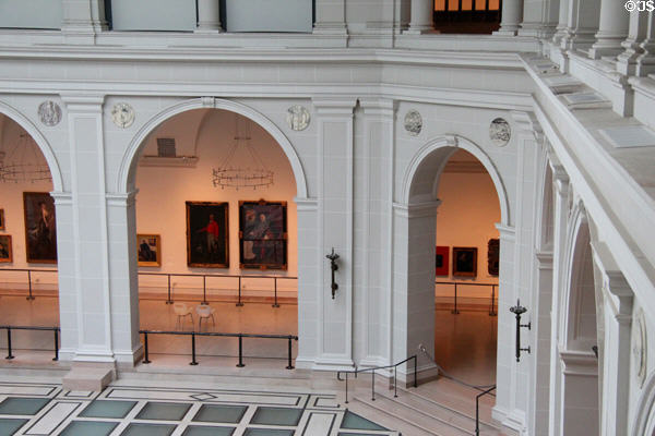 Paintings line covered courtyard at Brooklyn Museum. Brooklyn, NY.