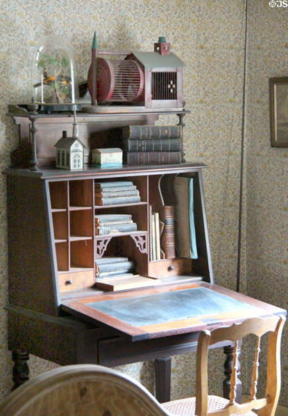 Drop front desk in bedroom in Layton Home at Old Bethpage Village. Old Bethpage, NY.