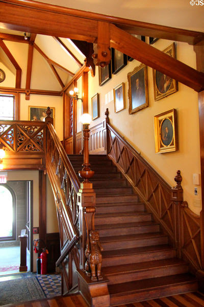 Stick staircase with society portraits at Newport Art Museum. Newport, RI.