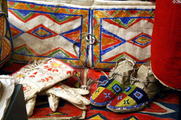 Native parfleche, gauntlets & moccasins at South Dakota State Historical Society Museum. Pierre, SD.