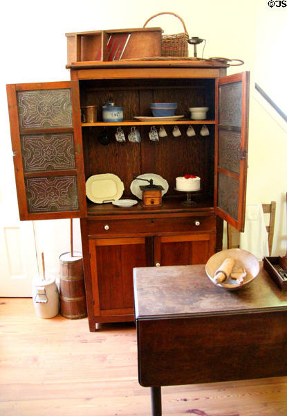 Pie safe with kitchen devices at East Terrace House. Waco, TX.