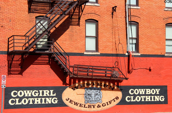Shop signs & fire escape in Fort Worth Stock Yards historic district. Fort Worth, TX.
