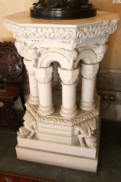 Sculpted lamp table being supported by pillars at Penrhyn Castle. Bangor, Wales.