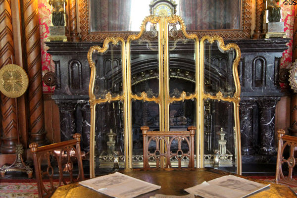 Glass panel fire screen protecting Drawing Room sitting area at Penrhyn Castle. Bangor, Wales.