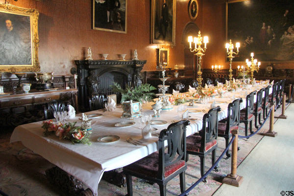 Dining room also serving as gallery for large collection of paintings at Penrhyn Castle. Bangor, Wales.