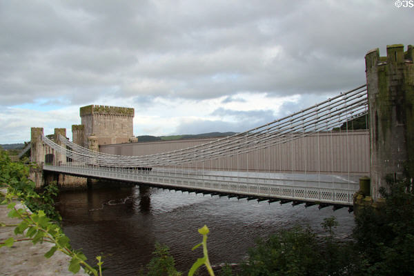 Telford's suspension bridge & Stephenson's tubular railway bridge spanning Conwy River. Conwy, Wales.