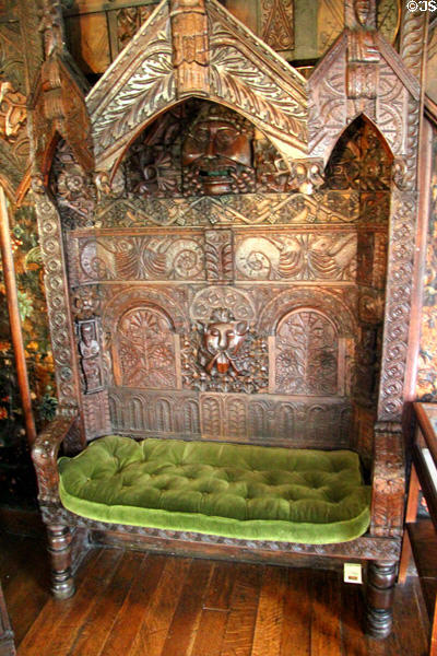 Confessional chair where mask with open mouth & ears was used for communication between priest & penitent, said to be from church in Spanish Place, London at Plas Newydd. Llangollen, Wales.