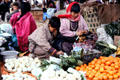 Cheeses and vegetables being sold at the Thimpu Saturday market. Bhutan.