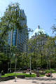 Christ Church Cathedral park with Cathedral Place & Hotel Vancouver. Vancouver, BC.