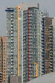 Yellow, red & blue striped residential tower beside General Motors Place. Vancouver, BC.