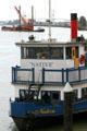 Bow of M.V. Native paddlewheeler against Fraser River traffic. New Westminster, BC.