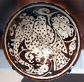 Luster Fritware bowl painted with mythical winged elephant from Iran at Aga Khan Museum. Toronto, ON.