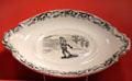 Earthenware transfer gravy boat stand with snowshoeing scene by Bo'ness Pottery of Fife, Scotland at Gardiner Museum. Toronto, ON.