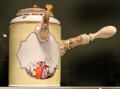 Meissen porcelain chocolate pot decorated in yellow with imaginary Chinese scenes in white quatrefoils at Gardiner Museum. Toronto, ON.