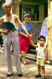 Old man and young boy on the streets of Chengdu. China.