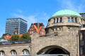 Green dome of St Pauli Pier with heritage & modern structures beyond. Hamburg, Germany.