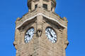 Detail of carved walrus heads on stone clock tower at St Pauli Pier. Hamburg, Germany.