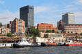 Empire Riverside Hotel Hamburg & Astraturm St.Pauli along Bernhard-Nocht-Straße with tug boats on Elbe. Hamburg, Germany.