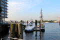 Boats moored on Elbe River at HafenCity district. Hamburg, Germany.