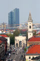 Victory gate by Eduard Mezger & St. Ludwig church spire by Friedrich von Gärtner with highrises beyond north of city. Munich, Germany