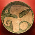 Earthenware bowl with bird design from Iran at Five Continents Museum. Munich, Germany.