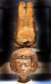 Egyptian carved wood head of queen Tiy with double feather crown decorated with gold, silver, etc. from Medinet el-Ghurob at Neues Museum. Berlin, Germany.