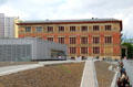Modern gray museum Topography of Terror building & red Gropius Museum. Berlin, Germany.