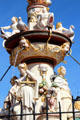 St Peter's Fountain detail with statues representing cardinal virtues of justice & courage under geese & putti riding dolphins in Hauptmarkt. Trier, Germany