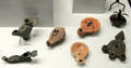 Roman-era bronze, iron & ceramic oil lamps at Bavarian State Archaeological Collection. Munich, Germany.