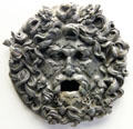 Bronze fountain mask of Roman god oceanus with marine animals in his hair at Bavarian State Archaeological Collection. Munich, Germany.
