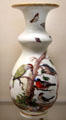 Meissen porcelain white vase painted with birds & insects at Meissen porcelain museum at Lustheim Palace. Munich, Germany.