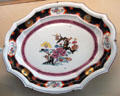 Meissen porcelain platter painted with flowers at Meissen porcelain museum at Lustheim Palace. Munich, Germany.
