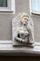 Carving of St Apollonia tortured by having her teeth violently pulled. Augsburg, Germany.