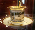 Porcelain cup & saucer with deer hunt from huts scene from Schney b. Lichtenfels, Bavaria at Coburg Castle. Coburg, Germany.
