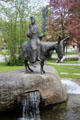 Passion Play sculpture of Christ with palm branch on donkey at Oberammergau theater. Oberammergau, Germany.