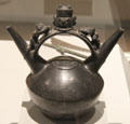 Lambayeque culture ceramic double-spouted bridge-handle vessel with religious scene from Peru at Museum of America. Madrid, Spain.