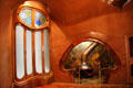 Window beside cubby hole sitting area around fireplace at Casa Batlló. Barcelona, Spain.