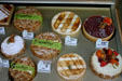 Cakes in bakery window. Besançon, France.