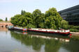 Barges on L'Ill River beside Vauban Dam & Hotel du Departement. Strasbourg, France.