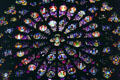 Rose window of Christ enthroned circled by apostles, saints & angels in south transept of Notre Dame Cathedral. Paris, France.