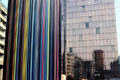 Le Moretti sculpture by Raymond Moretti with mirrored surface beyond at La Défense. Paris, France.