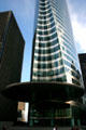 Almond shaped notch & saucer overhang over front edge of EDF building at La Défense. Paris, France.