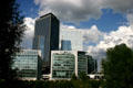 Black Adria & white Egée towers over low-rise residences at La Défense. Paris, France.
