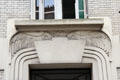 Doorway lintel carved with pair of roosters at Montmartre. Paris, France.