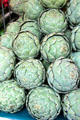 Stack of artichokes in food stall. Paris, France