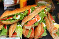 Long premade sandwiches in charcuterie. Paris, France.