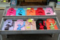 Brightly colored shirt & ties displayed in shop. Paris, France