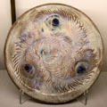 Ceramic plate painted with peacock feathers by Auguste Delaherche of Paris at Museum of Decorative Arts. Paris, France.